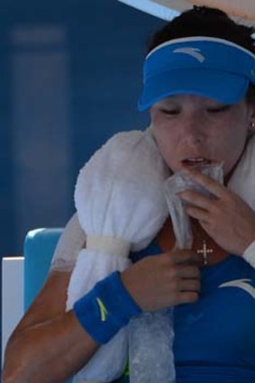 China's Zheng Jie cools off with an ice towel earlier in the match.