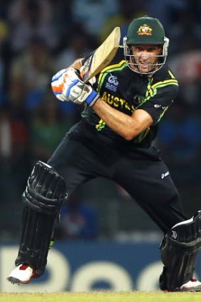 Main man: Mike Hussey unleashes against Pakistan.