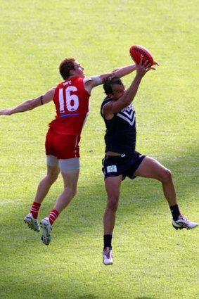 Overhead pressure &#8230; Sydney's Gary Rohan goes for the spoil in a determined Swans defensive display.