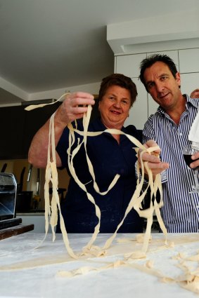 Happier times: Restauranteur Carlo Tosolini makes pasta with his mother Tina Tosolini.