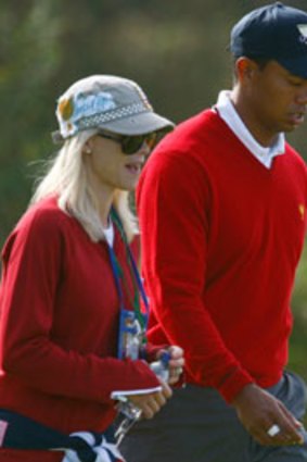 Domestic violence denials...Tiger Woods and wife Elin a month before the scandal erupted.