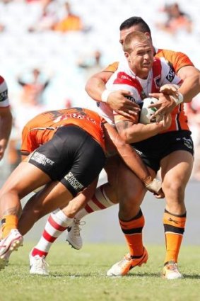 Digging in: Trent Merrin in action against Wests Tigers in round one.