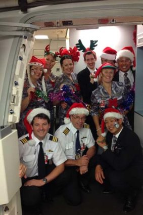 Qantas staff will be getting into the festival spirit with passengers flying on Christmas Day.