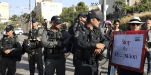 Israeli police stand guard at a demonstration in support of Palestinians in Sheikh Jarrah of East Jerusalem,where dozens of families face imminent forcible eviction from their homes by Israeli settlers.