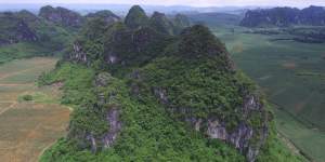 The mountainous location of two caves in southern China where fossils of the largest-ever primate have been found.
