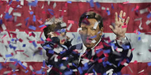 Incumbent Florida Republican Governor Ron DeSantis holds his son Mason as he celebrates winning reelection,at an election night party in Tampa,Florida,November 8,2022.