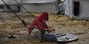 A child washing dishes inside the foreign fighters section of al-Hawl camp in April.