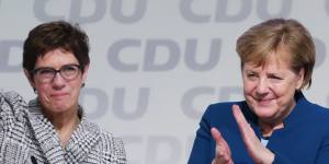 Angela Merkel,then chancellor and outgoing Christian Democrat Union leader,right,applauds Annegret Kramp-Karrenbauer on being elected to lead the party in 2018.