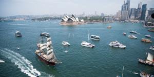 Tall ships race towards the Harbour Bridge on Australia Day 2020.