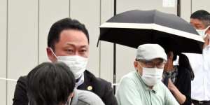 Security police tackle Tetsuya Yamagami after he shot former prime minister Shinzo Abe on Friday. 