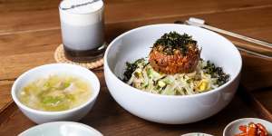 Yukhoe (raw beef) with seaweed,sprouts,rice and sides.