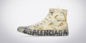 Fashionable sneakers,such as this Balenciaga deliberately distressed one,make an outsized contribution to climate change,even before they end up in massive dumpsites.