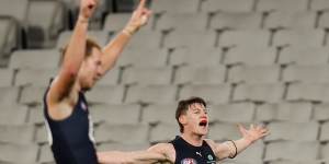 Sam Walsh celebrates his crucial final term goal against Collingwood on Sunday. 