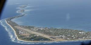 Funafuti,the main island of the nation state of Tuvalu,from the air. Only four Pacific island nations,including Tuvalu,were represented by their leaders at COP26,in Glasgow because of COVID-19 travel restrictions. 