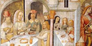 A (rather sanitised) version of a medieval feast from the biblical book of Job,painted in Cremona,Italy. But notice the dog scrounging for scraps.