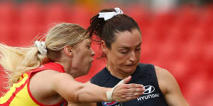 Nicola Stevens gets a kick away for the Blues at Metricon Stadium on Friday night.