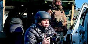 Darren Conway (left) filming on the frontline in Kharkiv.
