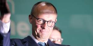 Friedrich Merz,the candidate of the mainstream conservative Christian Democratic Union party,addresses supporters at the party headquarters in Berlin,Germany.