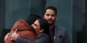 Victims of the Christchurch mosque shootings arrive at the Justice Precinct for the accused terrorist’s High Court hearing in 2020. Pictured:Linwood mosque hero Abdul Aziz hugs a friend outside court.