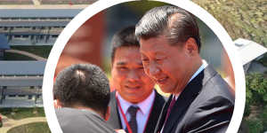 A photo of Xi Jinping greets students at the entrance to the $28 million school.