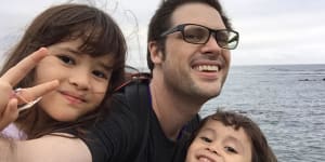 Freelance journalist Scott McIntyre with his two children in Japan.
