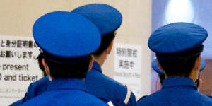 Security personnel arrive at the reception area for the World Opinion Leaders forum on Thursday night. 