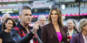 Sherrin the spotlight:Robbie Williams and Delta Goodrem at Thursday’s AFL grand final entertainment roll call.
