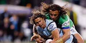 Nicho Hynes is tackled. 