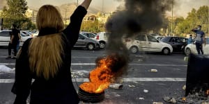 A protest in Iran over the death in police custody of Mahsa Amini.