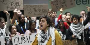 Activists participate in a demonstration for climate finance at the COP29 UN Climate Summit.