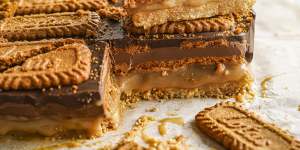 Caramel slice stacked with Biscoff biscuits and spread.