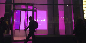 FILE - In this Nov. 10,2016,file photo,people walk past a Microsoft office in New York. China-based government hackers have exploited a bug in Microsoft’s email server software to target U.S. organizations,the company said Tuesday,March 2,2021. (AP Photo/Swayne B. Hall,File)