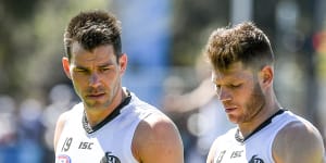 Collingwood's Levi Greenwood (left) with teammate Taylor Adams.