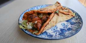 Garlic,ginger and paprika chicken skewers in a wrap.