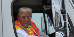 Republican presidential nominee former President Donald Trump talks to reporters as he sits in a garbage truck Wednesday,Oct. 30,2024,in Green Bay,Wis. (AP Photo/Julia Demaree Nikhinson)