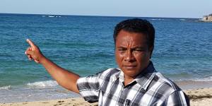 Semuel Messak,the head of Landu village in West Rote,where the Kanak came ashore,points to the rocks where the boat ran aground. 