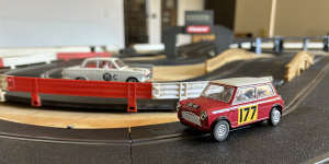 A Mini Cooper in the foreground,and in the background a Ford Cortina Mk I (a car the author once owned in real life).