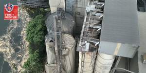 Hundreds of tonnes of wheat spilled into the Shoalhaven River on October 17,when two silos collapsed at the Manildra starch factory in Bomaderry,on the NSW South Coast. Vision:Fire and Rescue NSW