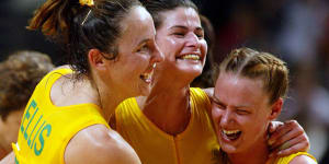 From left:Australian netballers Liz Ellis,captain Kathryn Harby-Williams and Sharelle McMahon embrace after their gold medal victory against New Zealand in the women’s’ netball final at the 2002 Commonwealth Games in Manchester.
