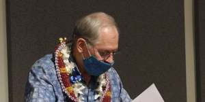 Elector John William Bickel puts his ballot in an envelope at the Hawaii State Capitol after voting for President-elect Joe Biden in the Electoral College in Honolulu on December 14.