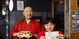 Chef Tomoyuki Matsuya pictured with his daughter Mone (and her drawing) in 2021.