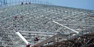 People work on the steel structure of the National Stadium,San Jose,Costa Rica.