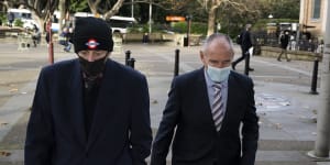 Chris Dawson (right) arrives at the NSW Supreme Court on Friday with his older brother,Peter Dawson.