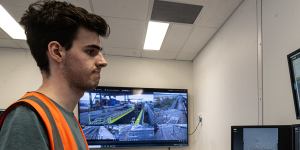 A Qube worker in the control room for the company’s import-expert terminal at Moorebank.
