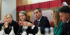 Jim Chalmers with Finance Minister Katy Gallagher,Treasury secretary Jenny Wilkinson and Productivity Commission member Angela Jackson,talks to the roundtable.