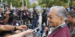 Former prime minister Mahathir Mohamad,97,speaks to reporters in his electorate on the island of Langkawi on Saturday.