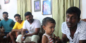 Fisherman Pathmanathan Anthony Pradeep with his son and other members of the group who travelled from Sri Lanka to Australia by boat on their friend’s trawler.
