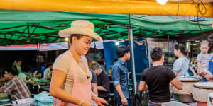 Made famous by Anthony Bourdain,tourists still flock to ‘Cowboy Hat Lady’
