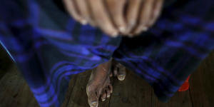 A victim of forced labor speaks during an interview in a village in northern Myanmar this month.