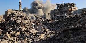 Smoke billows following an Israeli strike that targeted a building in the Bureij camp for Palestinian refugees in the central Gaza Strip on Sunday.